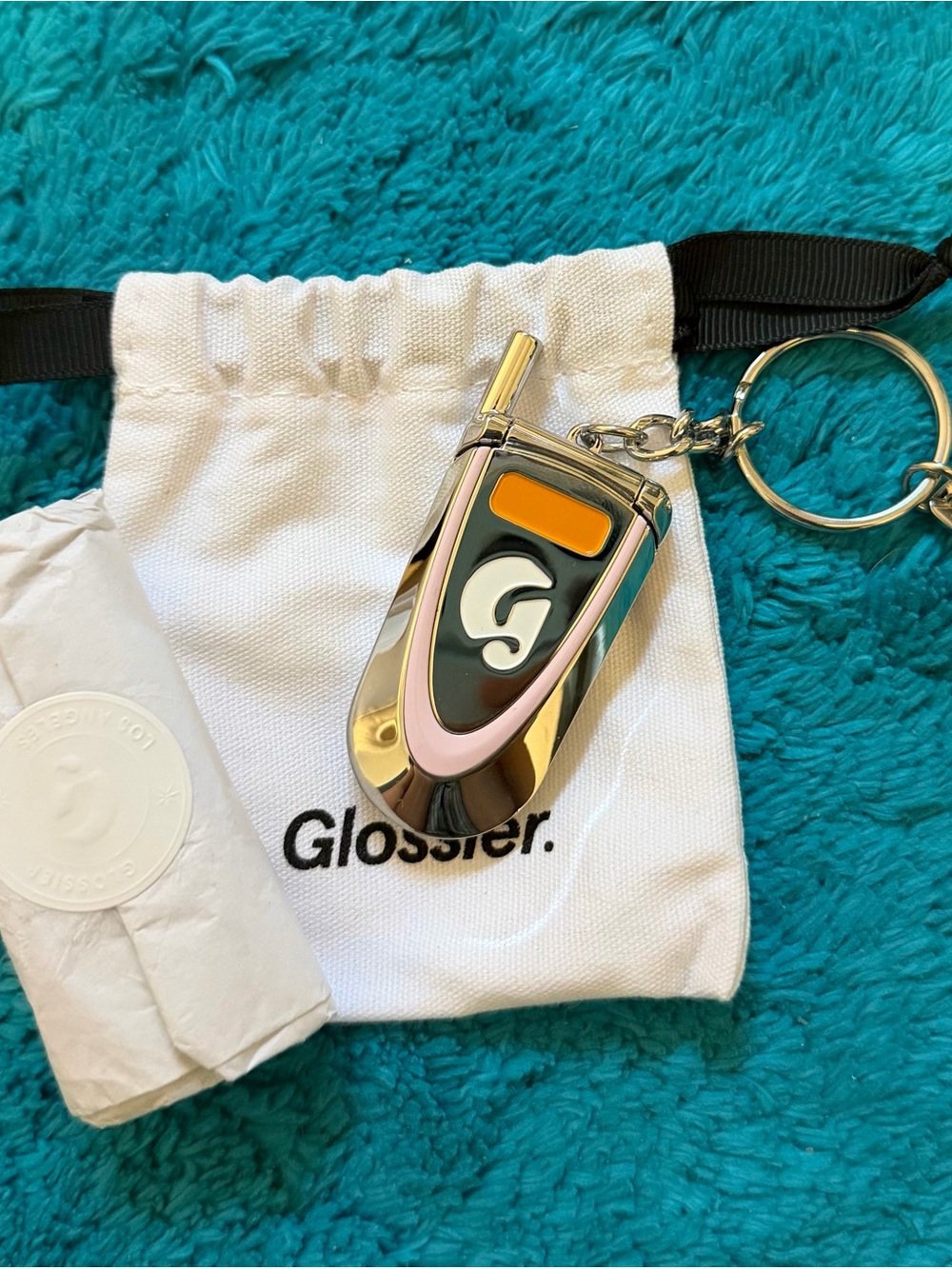 Glossier phone mirror keychain